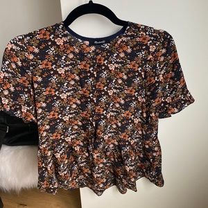 Button down for the top half. Bottom half slightly ruffled shirt